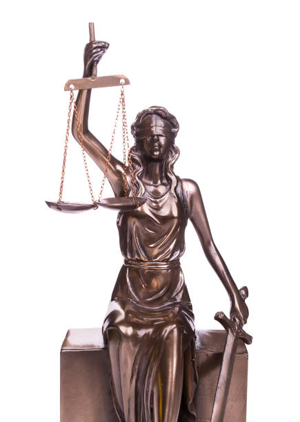 istock Statue of justice isolated on white 951982050