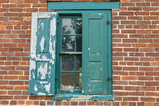old wooden window at a facade - photo