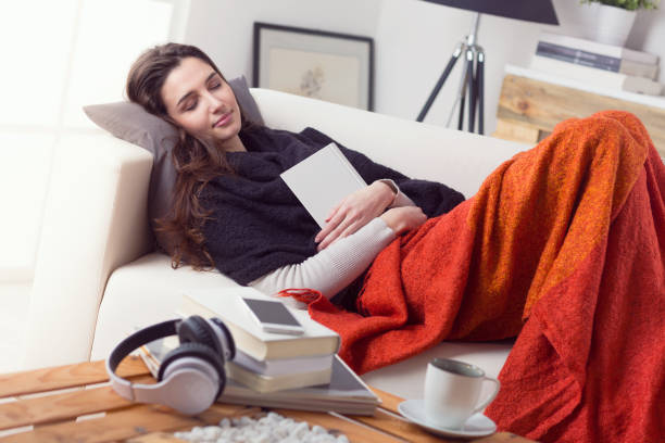 istock Woman asleep on the couch at home 951983436