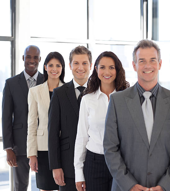 istock Smiling business team in a line 95198574