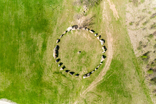 Eagle-eye aerial view of Stonehenge like structure in Rayuvtsi village, Bulgaria. The scene is situated in Rayuvtsi village near Elena, Bulgaria (Eastern Europe) during day. The footage is taken with DJI Phantom 4 Pro drone.