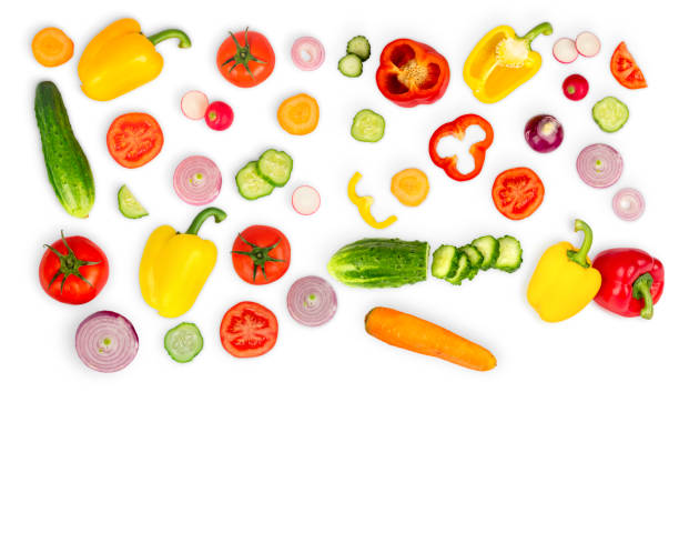 istock Vegetable mix on white isolated background. Fresh yellow pepper, chopped tomatoes, onion, round cucumber slice, carrot, radish. The concept of a healthy lifestyle. Vegetarian food. 951989710