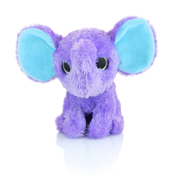 istock Elephant plushie doll isolated on white background with shadow reflection. Plush stuffed puppet on white backdrop. Purple or violet stuffed elephant toy for kids. 951990070