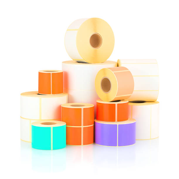 istock White and colored label rolls isolated on white background with shadow reflection. Color reels of labels for printers. Label for direct thermal or thermal transfer printing. 951995286
