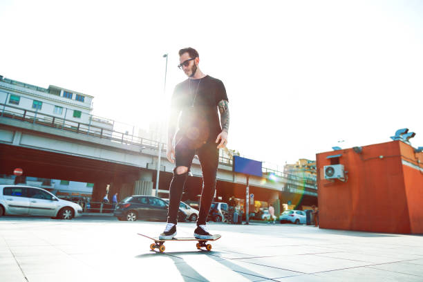 istock Young Men with his skateboard moving in the city 951995432