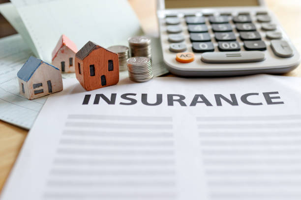 istock Home insurance form with money,passbook  and calculator. 951995884