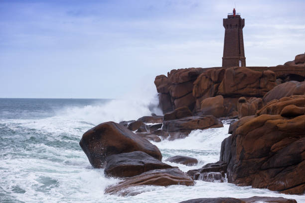 istock lighthouse Phare de Men Ruz and typical Brittany coast 951997526
