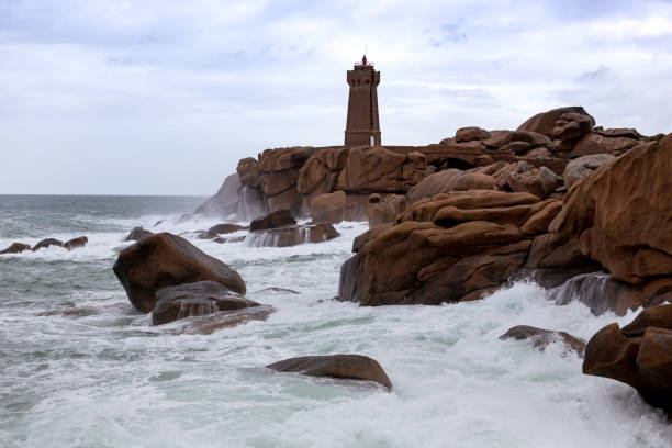 istock lighthouse Phare de Men Ruz and typical Brittany coast 951997654