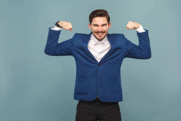 istock Strong mustache man showing muscule and toothy smiling 952000470
