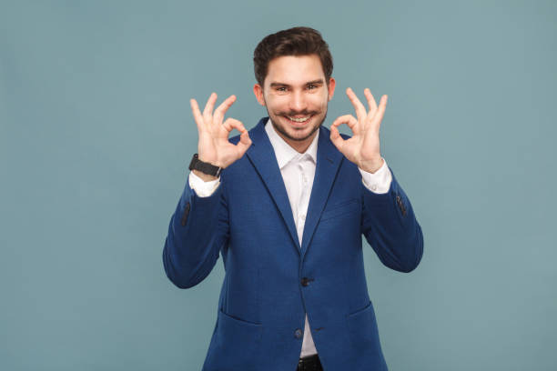 istock Handsome man with mustache showing ok sign at camera 952000522