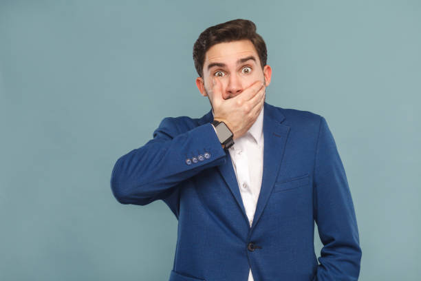 istock Surprised man with big eyes closed hands mouth 952000640