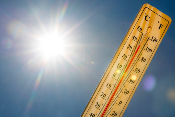 Mercury thermometer Summer heat Sun light Mercury thermometer marking 39 degrees Celsius 100 Fahrenheit in a sunny day. Summer heat shown on mercury thermometer against the blue sky. Sunlight with sun flares. heat wave photos stock pictures, royalty-free photos & images
