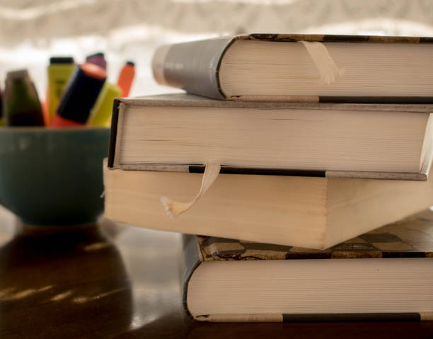istock Books and markers in a bowl placed on the table 952004356