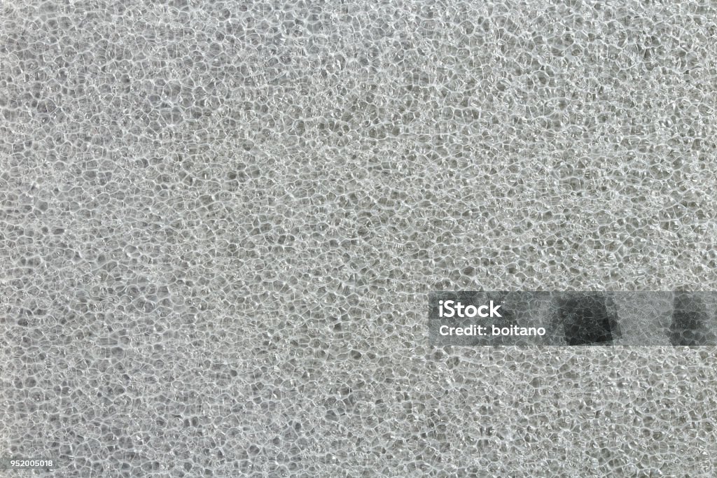 Air bubbles in close up. Bubbles background. Polyethylene EPE sheet. Polypropylene board foam. Plastic foam sheet texture. XPE/EPE foam insulation. Foam padding sheet. Packaging material. Foam - Material Stock Photo