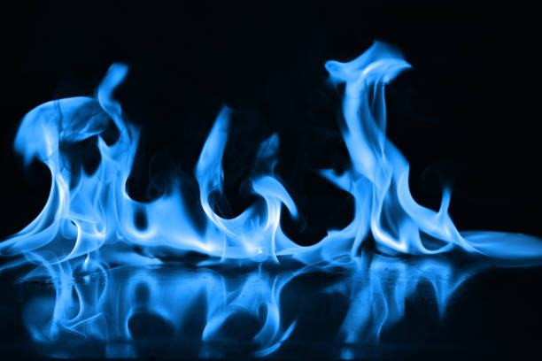 istock Beautiful blue fire flames on a black background 952005622