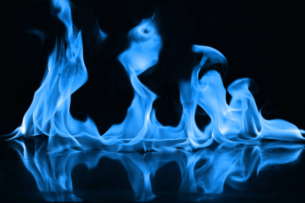 istock Beautiful blue fire flames on a black background 952005624