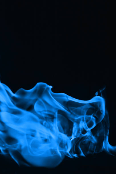 istock Beautiful blue fire flames on a black background 952005648