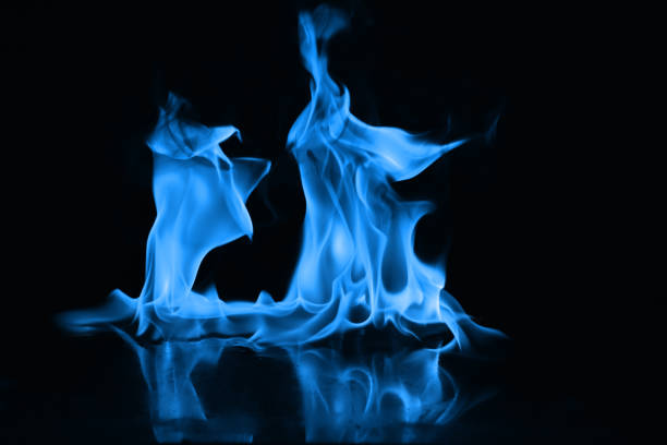 istock Beautiful blue fire flames on a black background 952005654