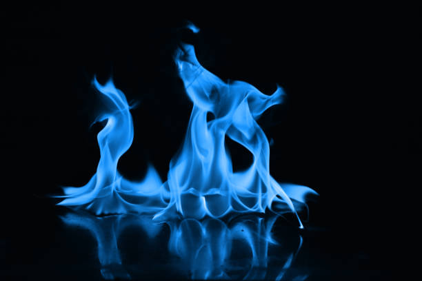 istock Beautiful blue fire flames on a black background 952005658