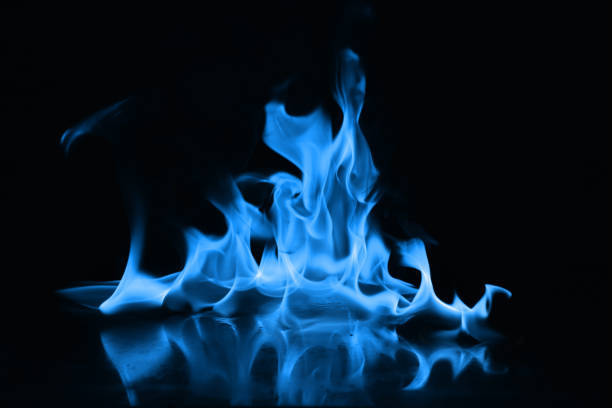 istock Beautiful blue fire flames on a black background 952005660