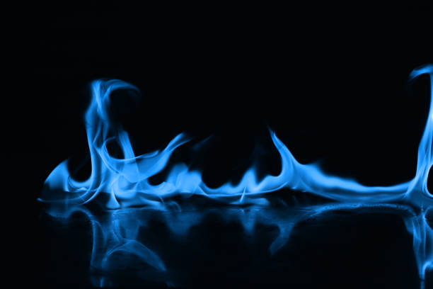 istock Beautiful blue fire flames on a black background 952005674