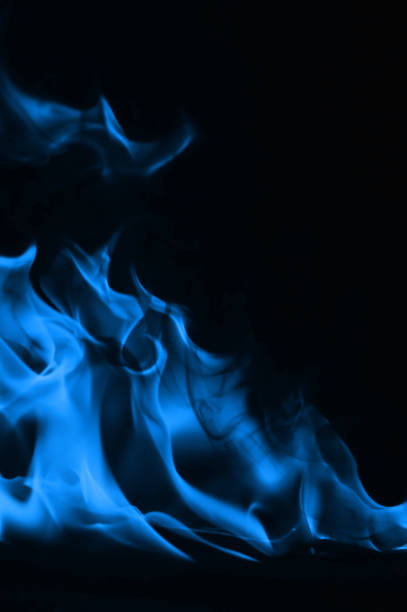 istock Beautiful blue fire flames on a black background 952005700