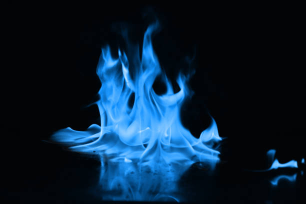 istock Beautiful blue fire flames on a black background 952005712