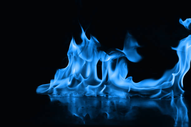 istock Beautiful blue fire flames on a black background 952005716
