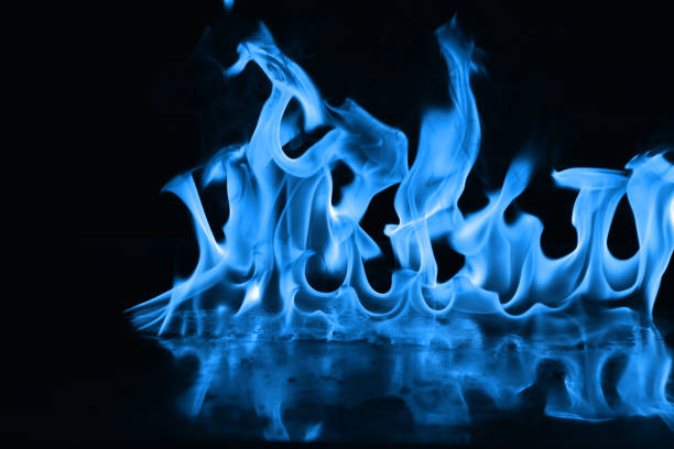 istock Beautiful blue fire flames on a black background 952005720
