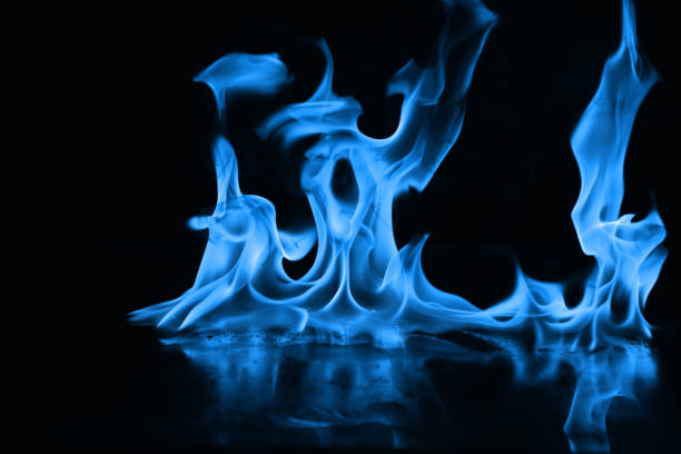 istock Beautiful blue fire flames on a black background 952005724