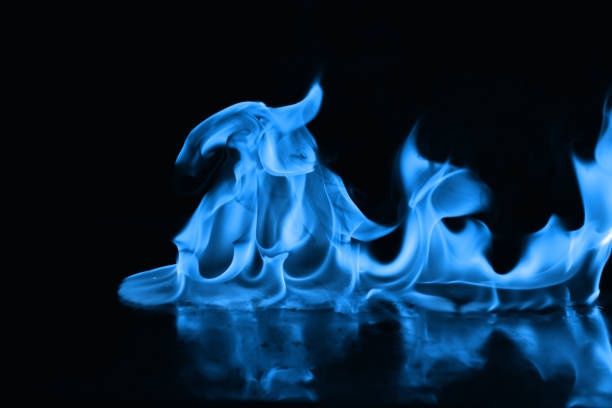 istock Beautiful blue fire flames on a black background 952005730