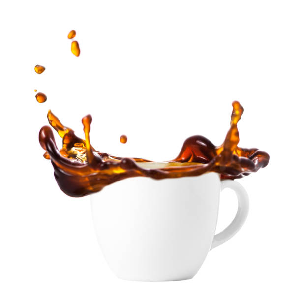 istock Black coffee is splashed out of a white cup of isolate on a white background, a splash of coffee 952008410