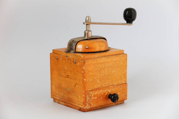 istock vintage old wooden coffee grinder. manual grinding. light background 952008950
