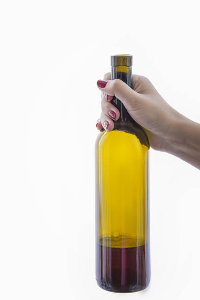 istock hand holding a bottle of wine on a white background 952009858