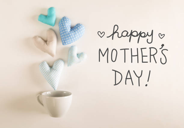 istock Mother's Day message with blue heart cushions 952012252