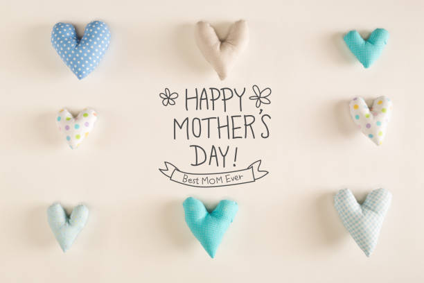 istock Mother's Day message with blue heart cushions 952012254