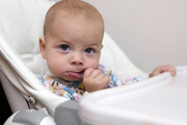 istock Baby boy in high chair 952013492