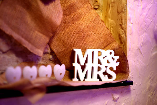 Fancy MR and MRS sign as a decoration on a table set for wedding reception