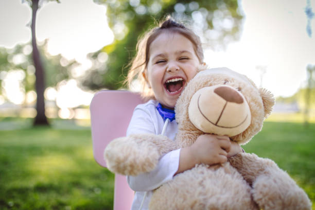 istock Gorgeous child doctor and her teddy bear 952014744