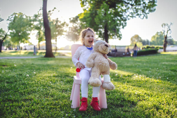 istock Cheerful child in the park dressed as a doctor 952014906