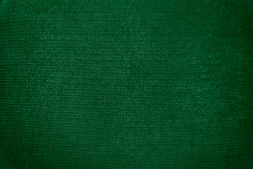 Dark green velvet texture background. Green velvet fabric