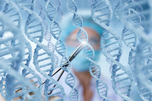 Doctor examines DNA molecules on blurred background.