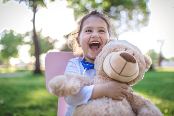 Cheerful child doctor and her patient
