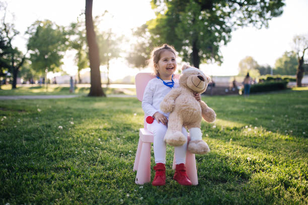 istock Cheerful child in the park plays doctor 952018648