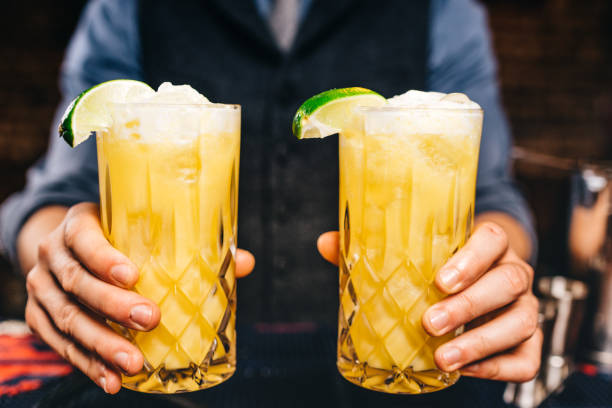 istock close up drinks at bar. Alcoholic orange vodka served with lime at restaurant and bar or pub 952019290