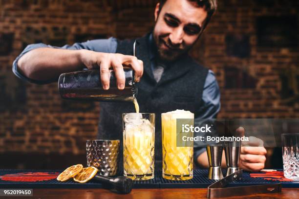 Professional Barman Preparing Cocktails And Pouring Fresh Alcohol In Glasses Cocktails Served In Bar Restaurant Or Pub Stock Photo - Download Image Now