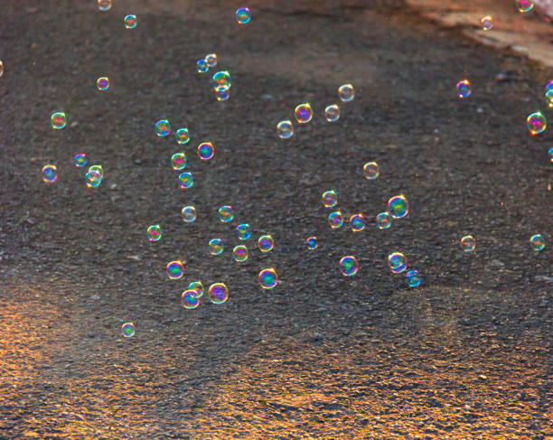 istock Soap bubbles floating on the street. 952019530