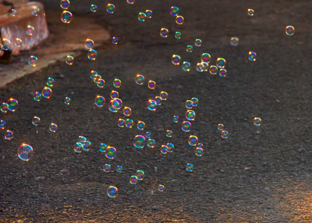 istock Soap bubbles floating on the street. 952019692