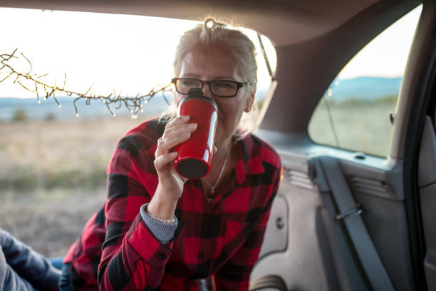 istock Senior woman outdoors with car 952020566