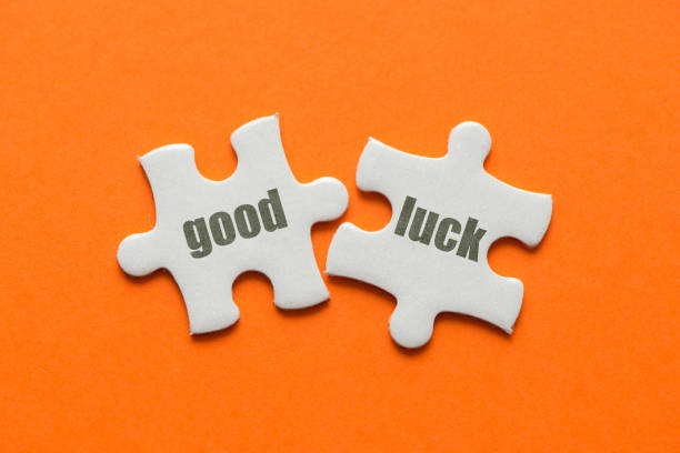 istock The word Good Luck on two matching puzzle on orange background 952024282